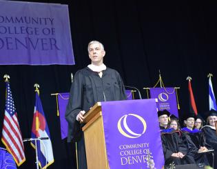 CCD commencement speaker at podium