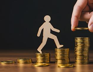 stock photo of coins and person walking on them