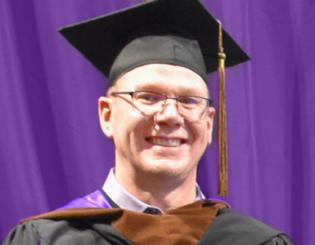 A man in a cap and gown.
