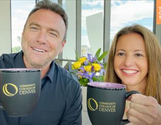 A man and a woman holding coffee cups.