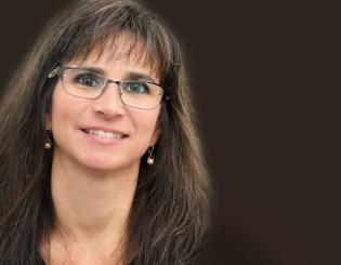 headshot of female with glasses