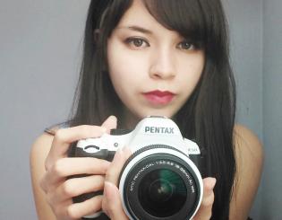 woman holding a camera