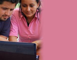 two people on a computer