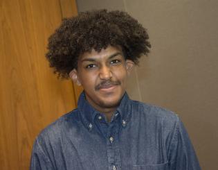 male student with blue shirt on