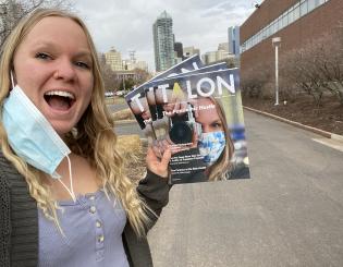 ccd student Jenna Duke hold a copy of the talon