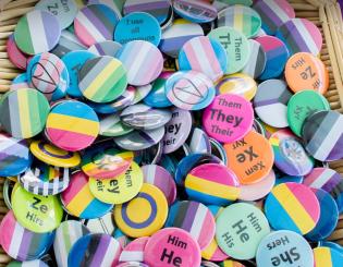 basket of LBGTQ affirming buttons