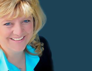 headshot of female with blue shirt