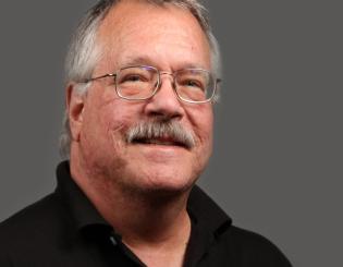 headshot of male wearing glasses