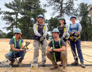 Group of 5 students wearing hard hats