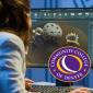 Person with brown shoulder length wearing a blue shirt looking at a computer screen. Community College of Denver logo
