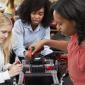 Robotics students working with their professor