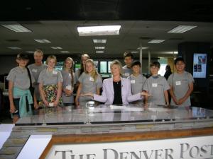 students at The Denver Post with TV news anchor