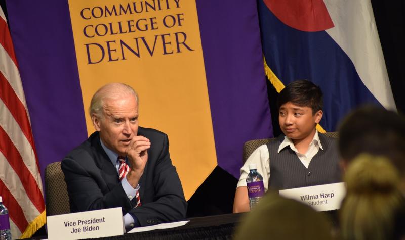picture of Vice President Joe Biden and CCD student in front of a Community College of Denver sign.