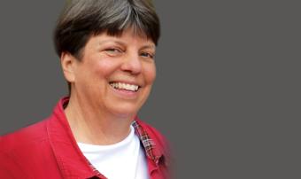 headshot of female with red shirt
