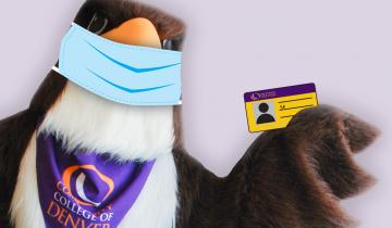college mascot with protective mask on holding student ID