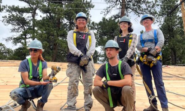 Group of 5 students wearing hard hats