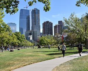 Denver skyline, and people walking at a park