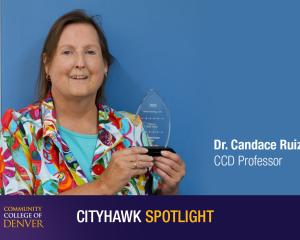 Image of Dr Candace Ruiz accepting an award with a blue background 