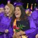 female grads smile at commencement