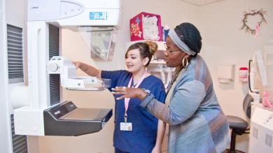 A Radiologic Technologist at Kaiser Permenente trains a CCD student on mammography.