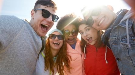 students smiling with sunglasses