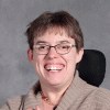 headshot of woman wearing glasses