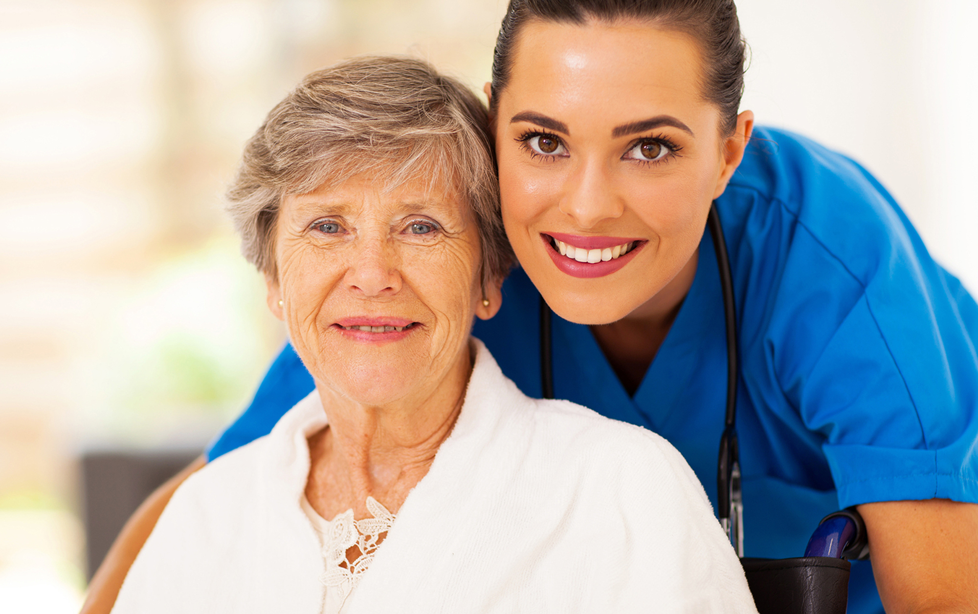 image of a woman nurse with an older woman patient