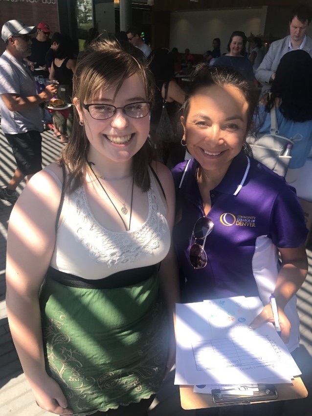 Welcome Back Students to Auraria Campus two females at an event